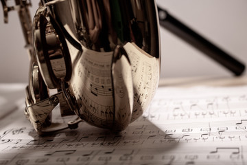 saxophone resting on sheet music