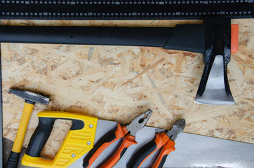 Wood tools on wooden background. Home tools sawdust.