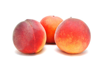 Ripe juicy peach on white background close up