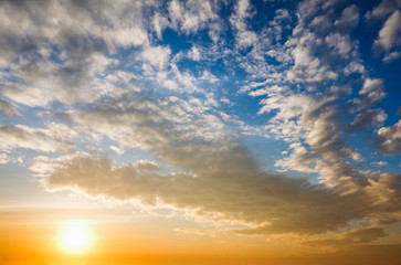 Colorful beautiful sunset with the orange cloud background