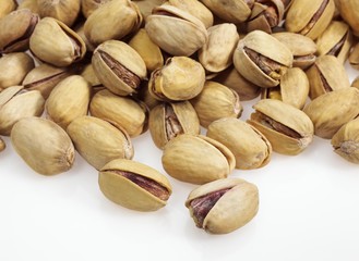 Pistachio Nuts, pistacia vera, Dry Fruits against White Background