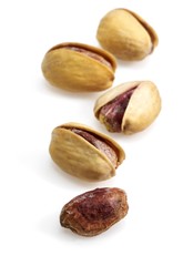 Pistachio Nuts, pistacia vera, Dry Fruits against White Background