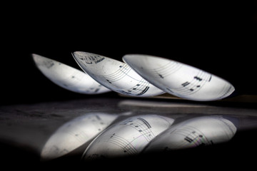 trio of spoons with music reflected