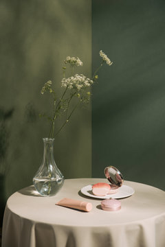 Woman daily makeup cosmetic essentials. Assorted objects.