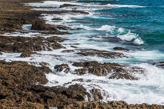 Coastal reef and sea waves with blue sky in the Kending National Park of Pingtung, Taiwan.