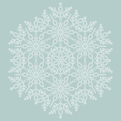 Round vector snowflake. Abstract winter ornament. Light blue and white snowflake