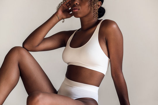 Black woman in white lingerie