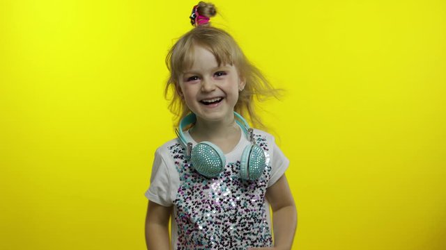 Joyful child laughing out loud with tears, feeling carefree joyful after hearing funny, silly joke