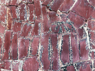 Hooligan smeared paint the walls of the old building. Landscape style. Grungy concrete surface with...