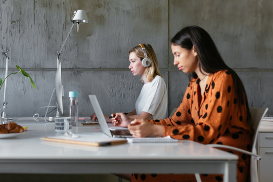 Young women working at desk in office