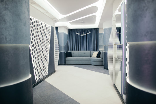 Stylish hallway with comfortable sofa