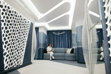 Young person reading in lounge room