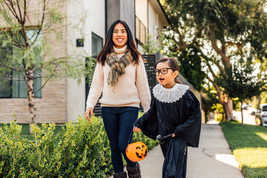 Child Plays in Halloween Costume