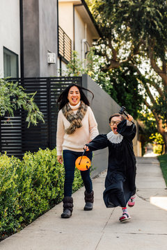 Child Plays in Halloween Costume