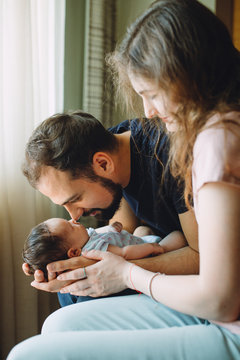 Newborn girl with father and mother