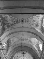 Interior Roman catholic sanctuary. Artistic look in black and white. - obrazy, fototapety, plakaty
