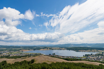 landscape with lake, mountains and beautiful clouds