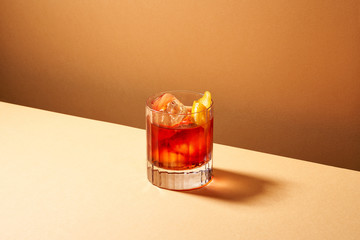 Appetizing red drink with sliced lemon