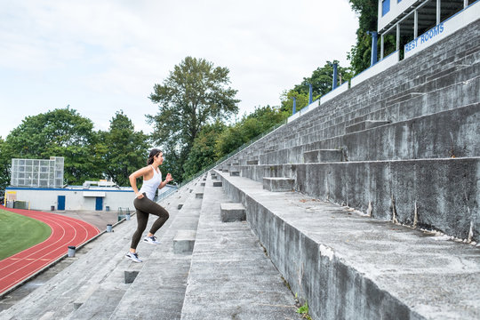 Active Woman Running Up the Stairs