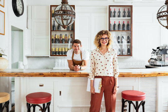 Restaurant Owner And Bartender Near Counter