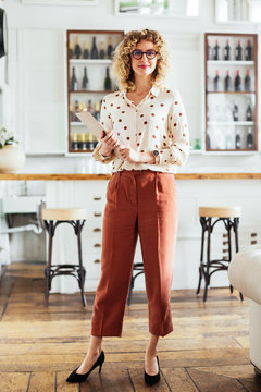 Confident restaurant owner looking at camera