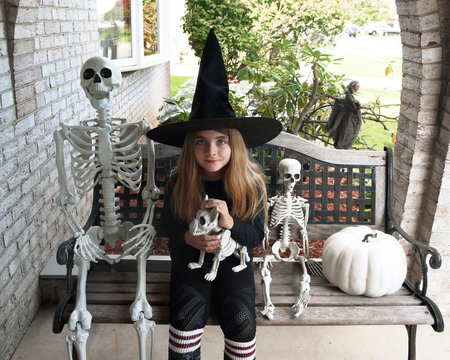 Halloween Child with Skeleton Decor Outside