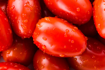 Close-up of fresh cherry tomatoes on white background