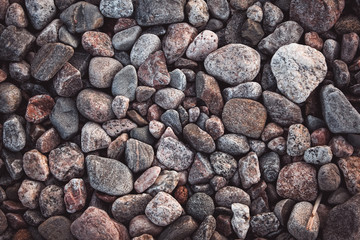texture with multicolored stones on rocky beach