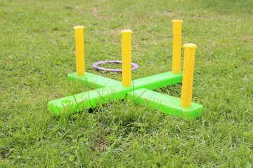 children's play ring toss on green grass
