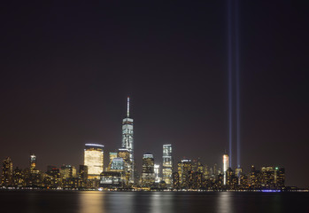 A view of the new york city skyline during the yearly 9/11 tribute
