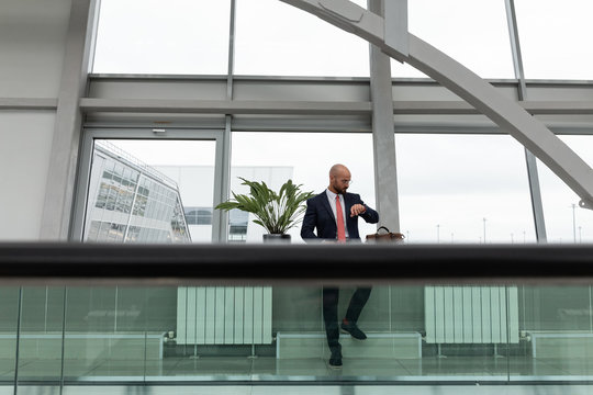 Businessman checking time in airport