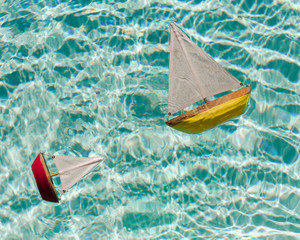 Wooden Toy Boats in Pool