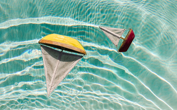 Wooden Toy Boats in Pool