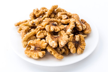 Close-up of delicious walnuts on a white dish