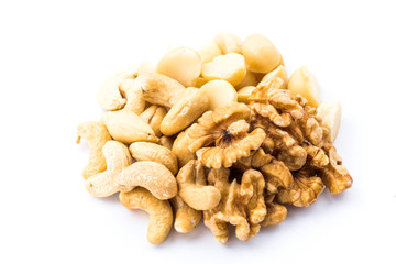 Variety of fresh nuts on the white background