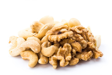 Some cashews, macadamias, and walnuts on a white background
