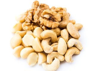 Variety of fresh nuts on the white background