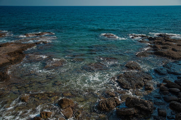 Fototapeta na wymiar beautiful sea with large stones near the shore and turquoise water