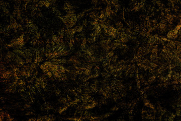 Fototapeta na wymiar Undefined background of different textures and materials that form a fantasy dark aerial landscape. Abstract art.