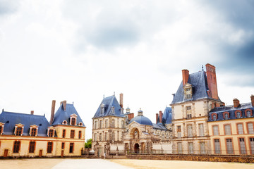 Fototapeta na wymiar Historic buildings in inner yard of French king royal Fontainebleau palace, France