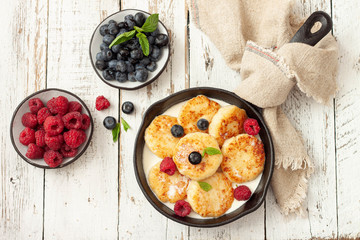 Cottage cheese pancakes with raspberries and blueberries.