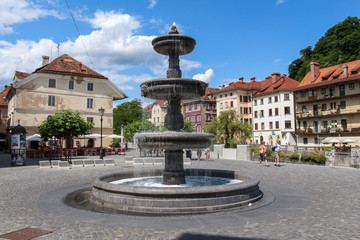 Fototapeta premium Water Fountain in Novi Trg, Justice Square, Ljubljana, Slovenia