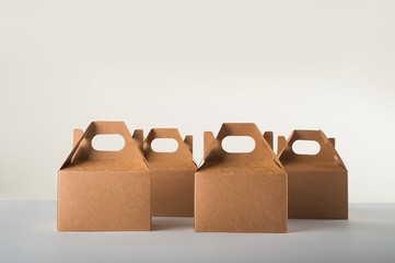 Cardboard boxes on a white background. Ecological packaging of paper products close-up and copy...