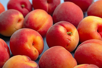 Fototapeta na wymiar pile of apricots photographed with selective focus - closeup