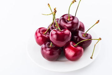 Close-up fresh cherries fruit isolated on white background