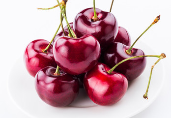 Close-up fresh cherries fruit isolated on white background