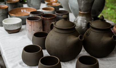 unburned clay vessels on table