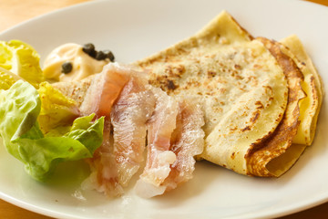 Gravlax with pancake served salad