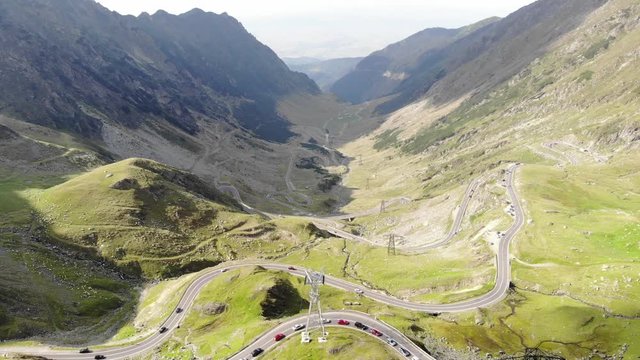 Aerial drone footage over beautiful Transfagarasan highway road winding curvy in the Fagaras Mountains Romania