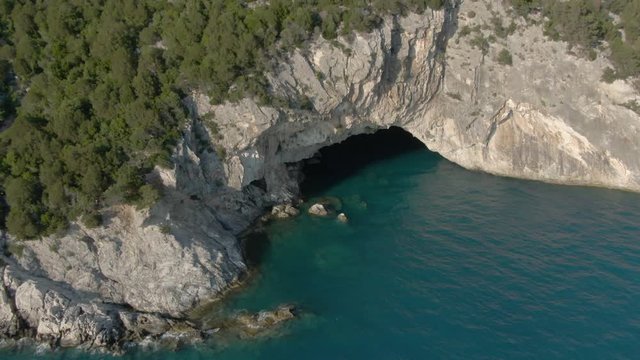 Aerial view of Papanikolis Cave on a sunny weather in Lefkada in Greece